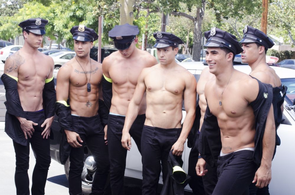 Topher DiMaggio, Peter Le, Brian Prince Roman, Rocky Santos, Murray Swanby, Cory Zwierzynski and Jonny Manzanares are sexy cops having a car wash for Andrew Christian.